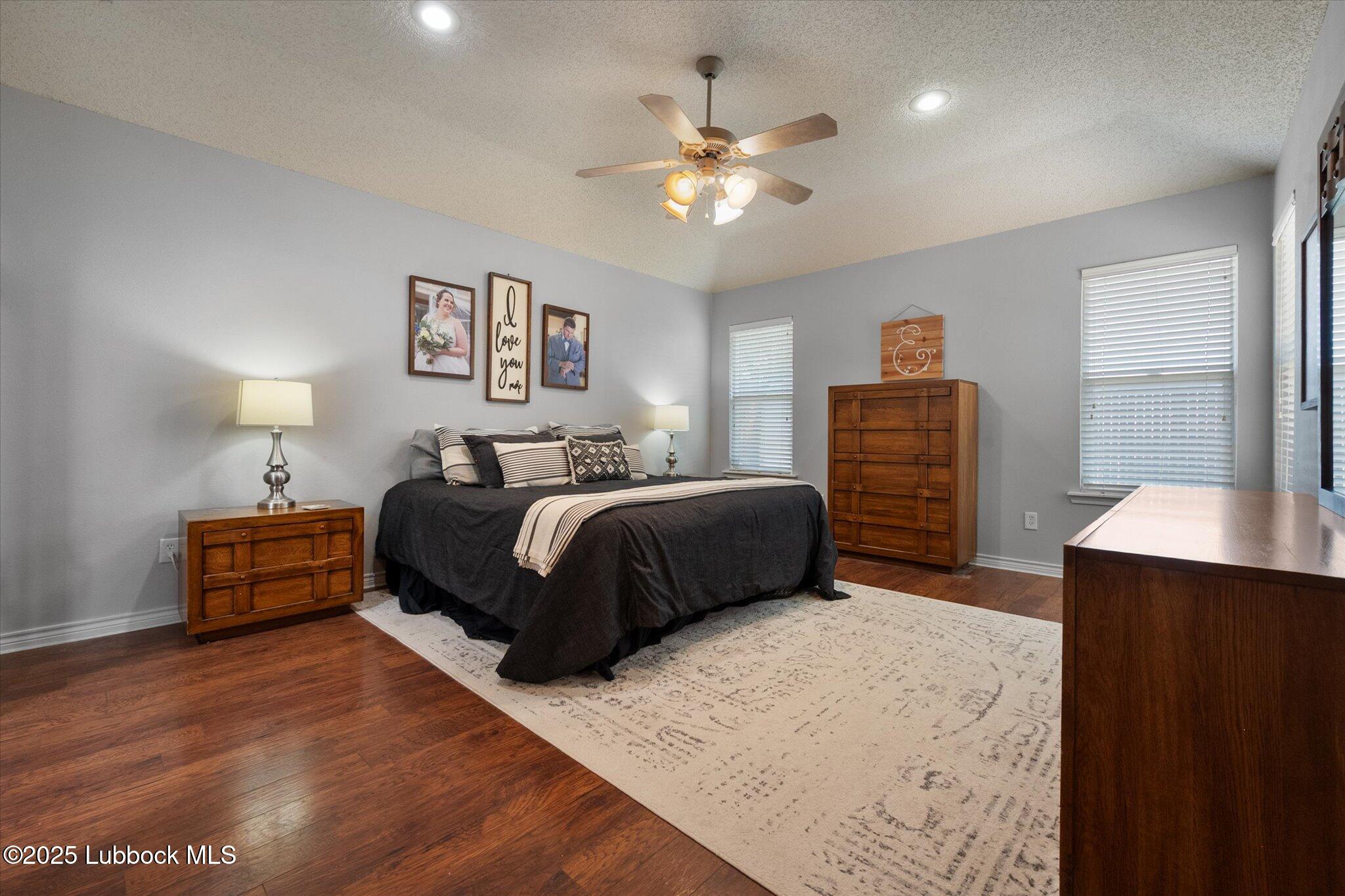 10401 Elgin Avenue Lubbock, TX 79423 - Photo 17 of 27 a bedroom with a bed and dresser