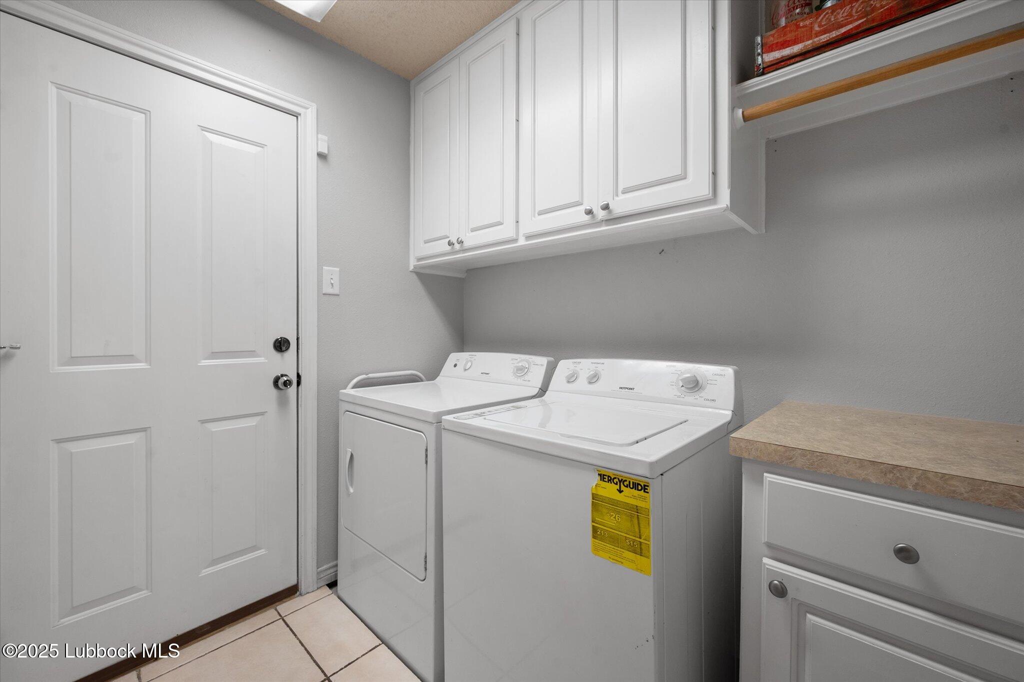 10401 Elgin Avenue Lubbock, TX 79423 - Photo 24 of 27 a utility room with dryer and washer