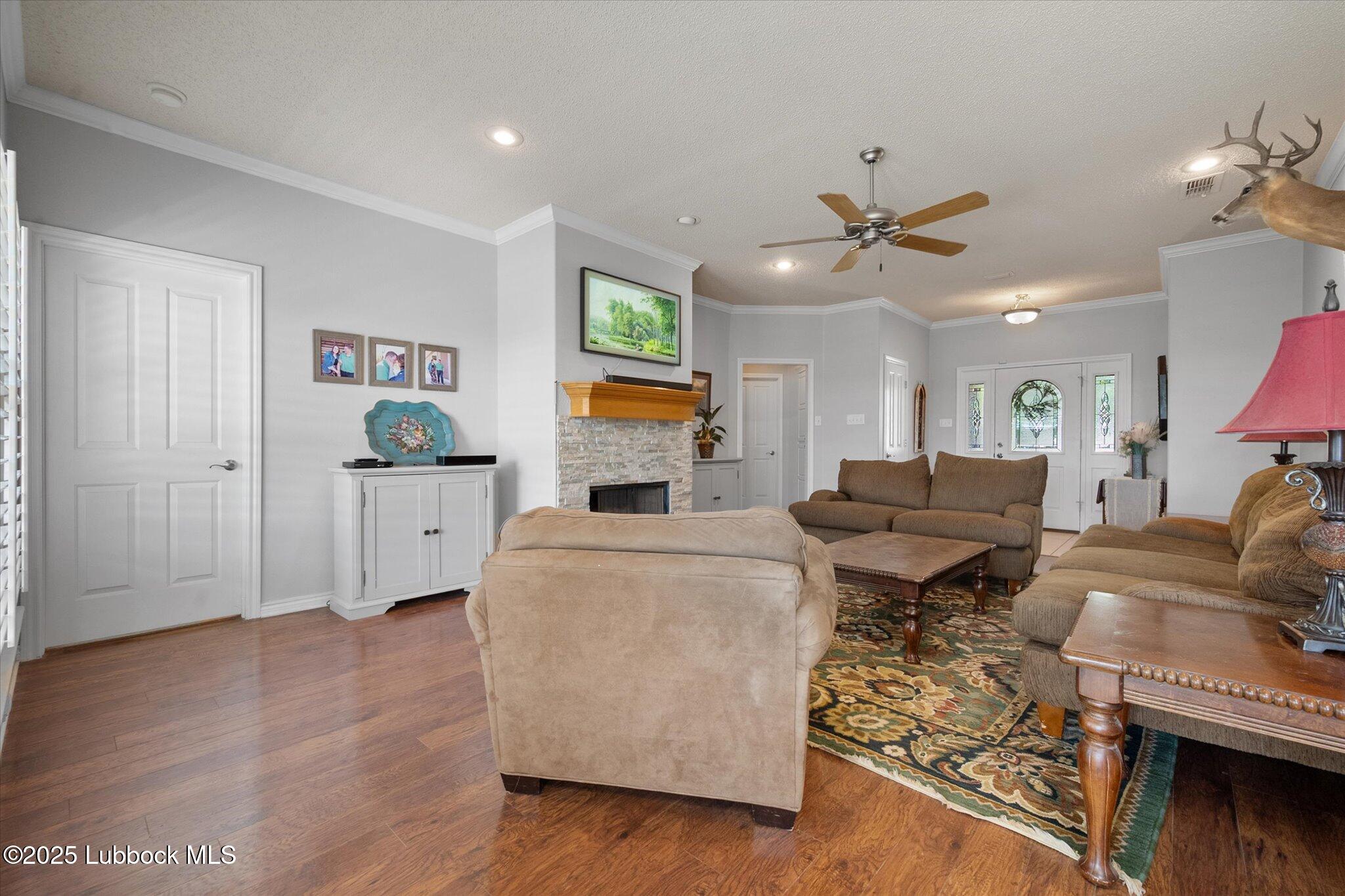 10401 Elgin Avenue Lubbock, TX 79423 - Photo 7 of 27 a living room with furniture and a flat screen tv
