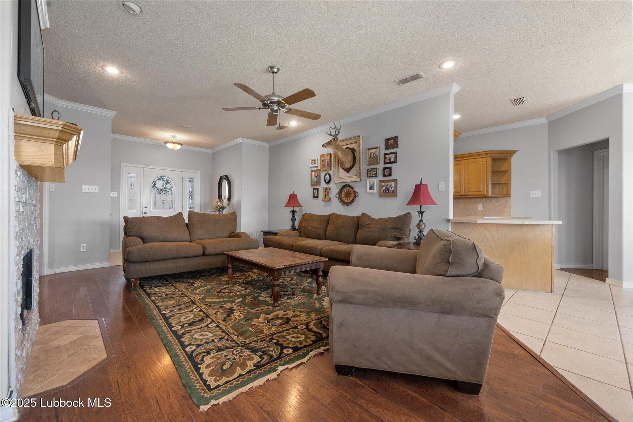 10401 Elgin Avenue Lubbock, TX 79423 - Photo 8 of 27 a living room with furniture and a flat screen tv
