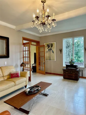 a living room with furniture gym equipment and a flat screen tv