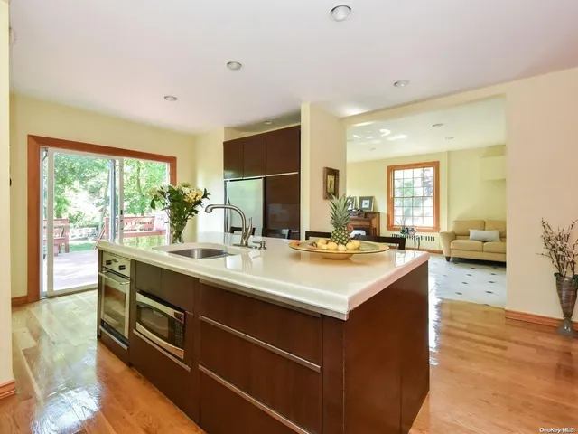 a kitchen with a sink and large window