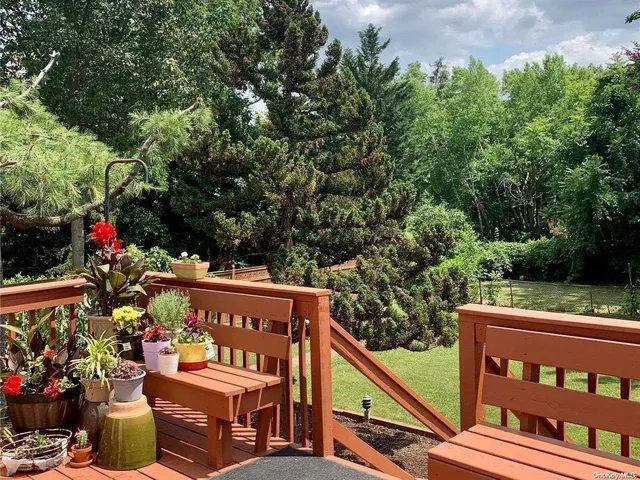 a view of a chairs and table in the balcony