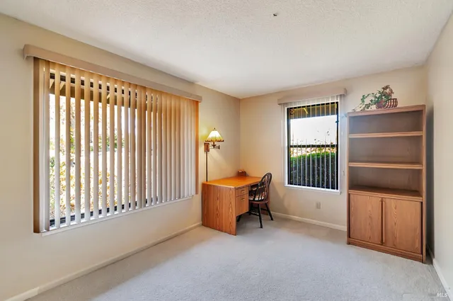 a livingroom with furniture and a window