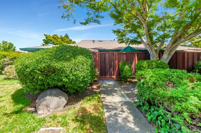 a backyard of a house with lots of green space