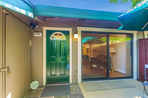 a view of a entryway door front of a house