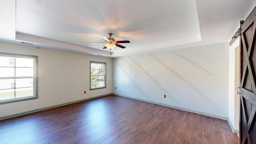 2499 Sinclair Trace Powder Springs, GA 30127 - Photo 20 of 42 an empty room with wooden floor and window