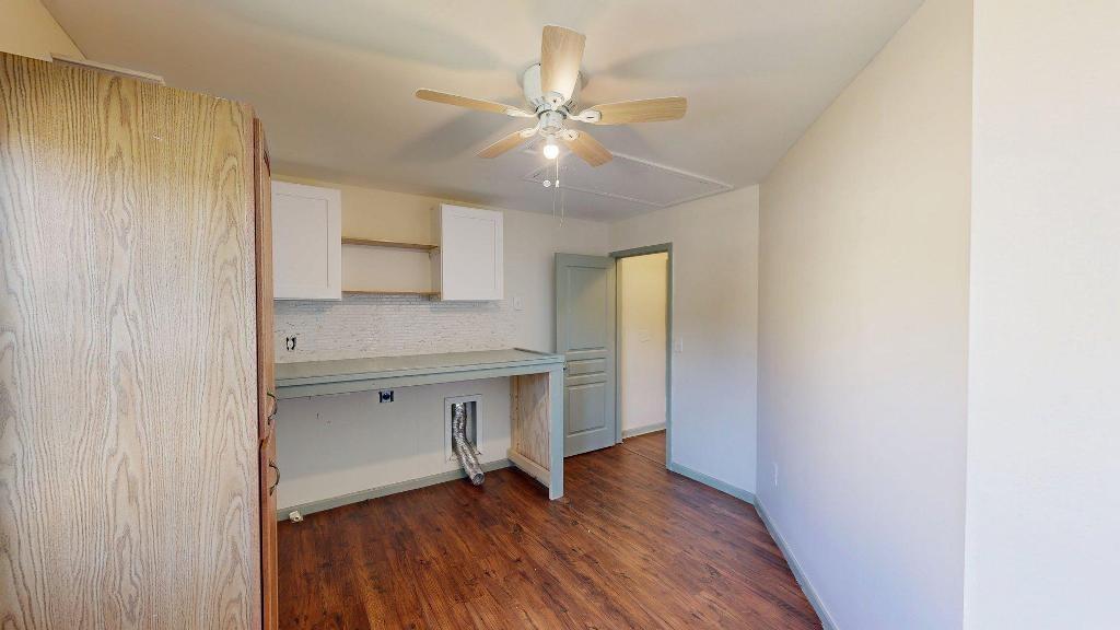 2499 Sinclair Trace Powder Springs, GA 30127 - Photo 27 of 42 a view of an empty room with a window and wooden floor
