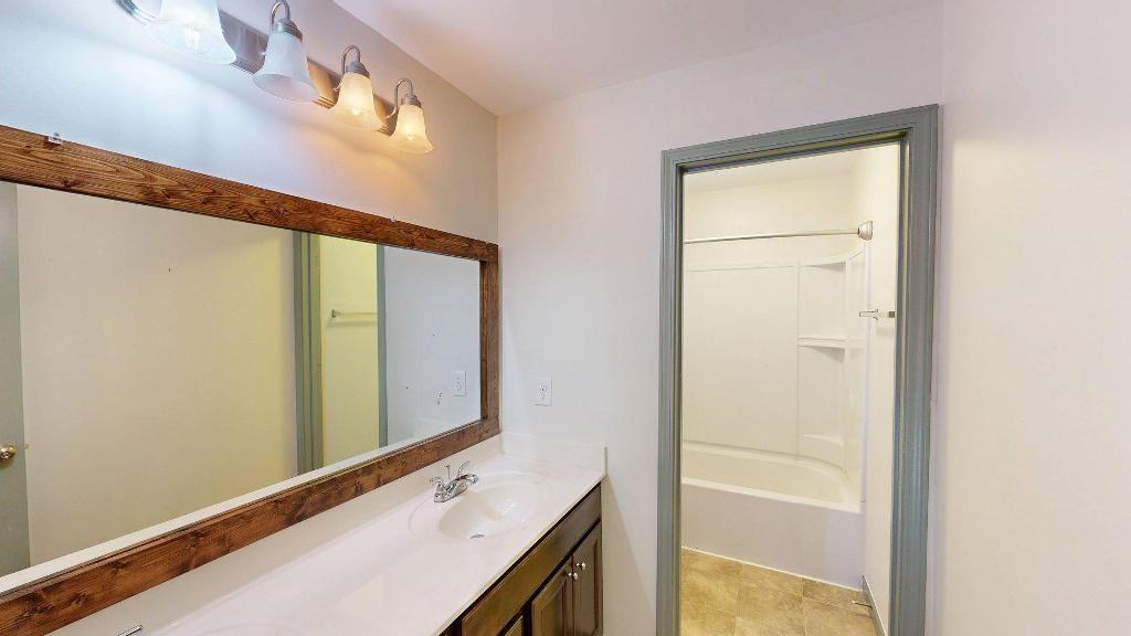 2499 Sinclair Trace Powder Springs, GA 30127 - Photo 32 of 42 a bathroom with a sink and a mirror