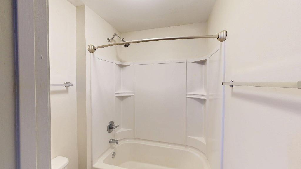 2499 Sinclair Trace Powder Springs, GA 30127 - Photo 33 of 42 a bathroom with a shower and a bath tub