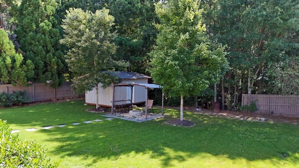 2499 Sinclair Trace Powder Springs, GA 30127 - Photo 36 of 42 a view of a backyard with a garden and deck