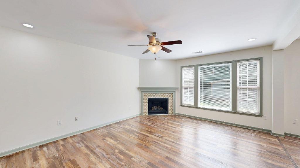 2499 Sinclair Trace Powder Springs, GA 30127 - Photo 6 of 42 a view of an empty room with a window and a kitchen
