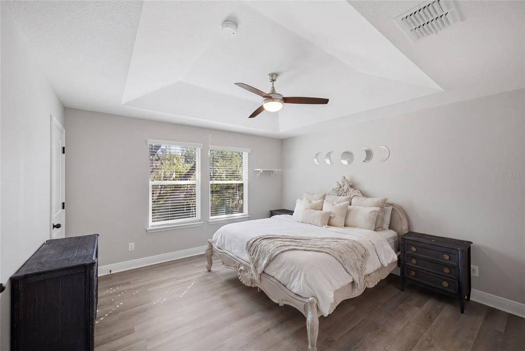 2013 Sunset Wind Loop Oldsmar, FL 34677 - Photo 15 of 43 a bedroom with a bed and wooden floor