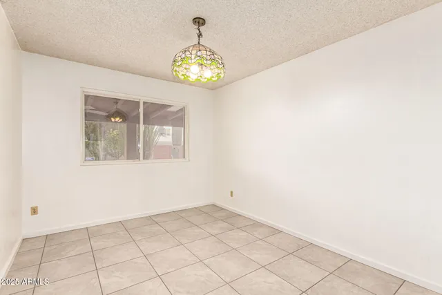 an empty room with a fan