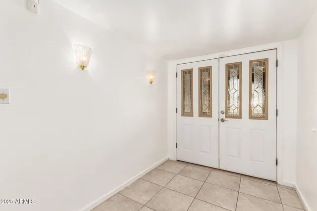 a view of an empty room with windows