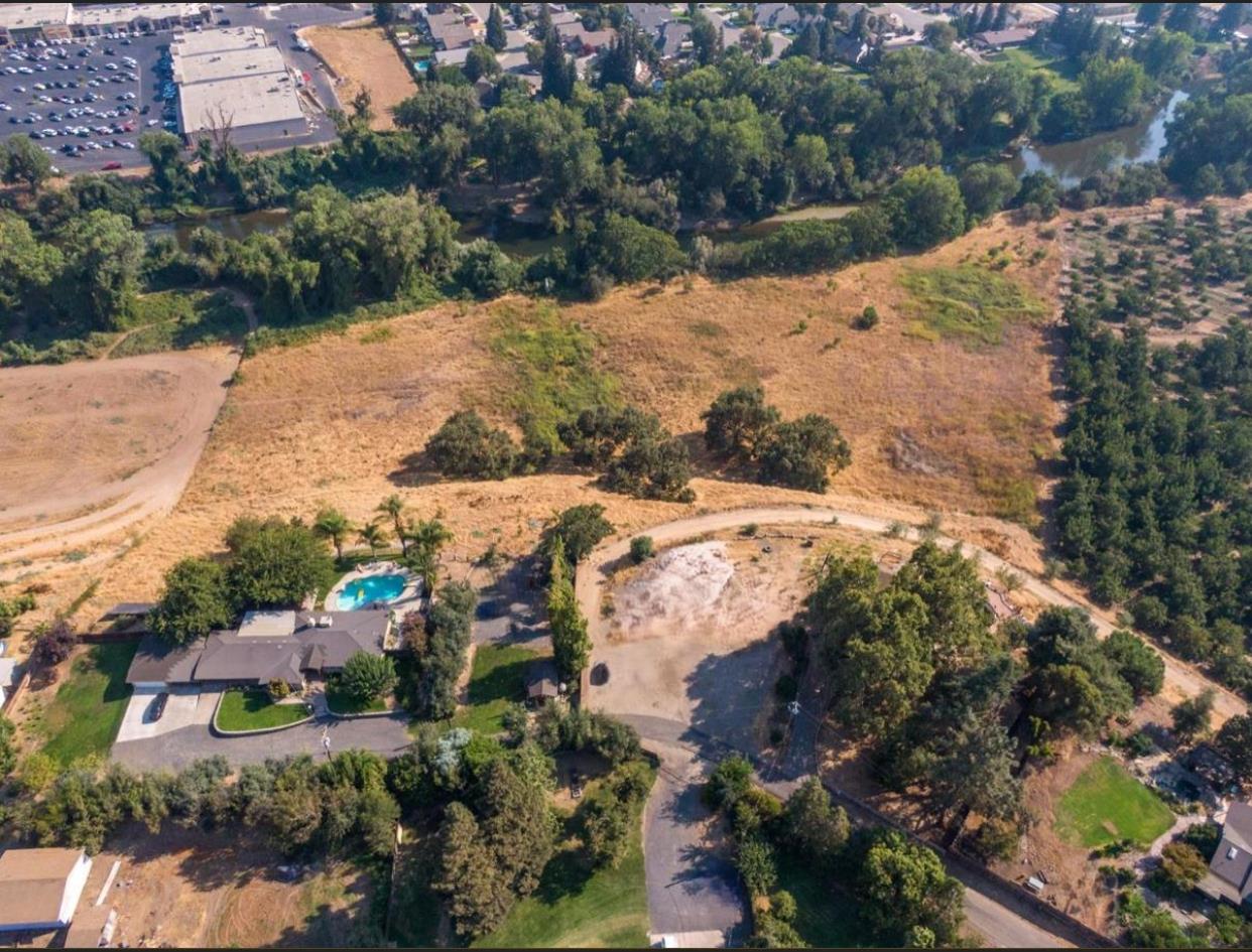 9591 Jackson Road Oakdale, CA 95361 - Photo 8 of 12 an aerial view of residential houses with outdoor space