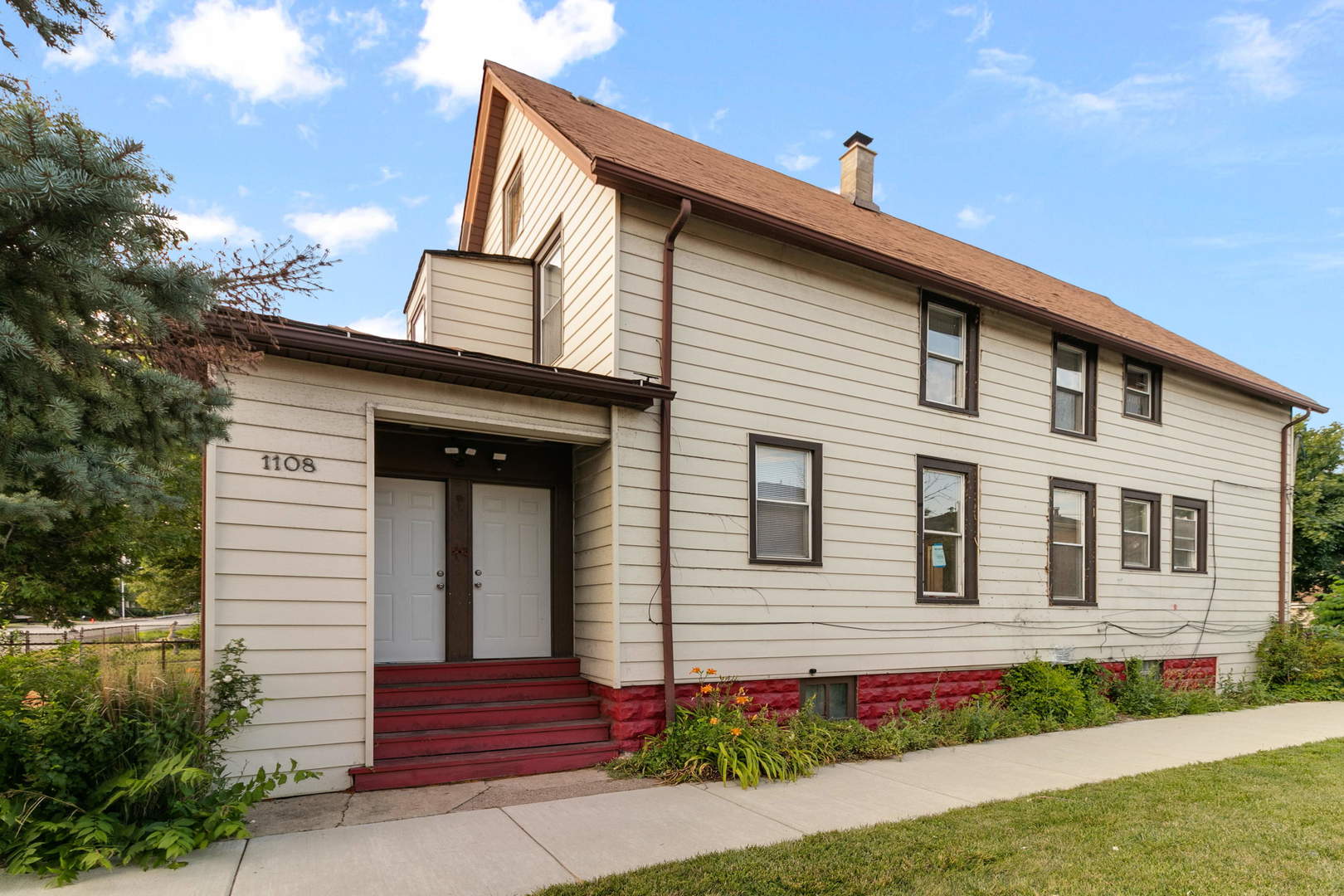 1108 Des Plaines Avenue, Unit 2 Forest Park, IL 60130 - Photo 1 of 1 a front view of a house with a garden