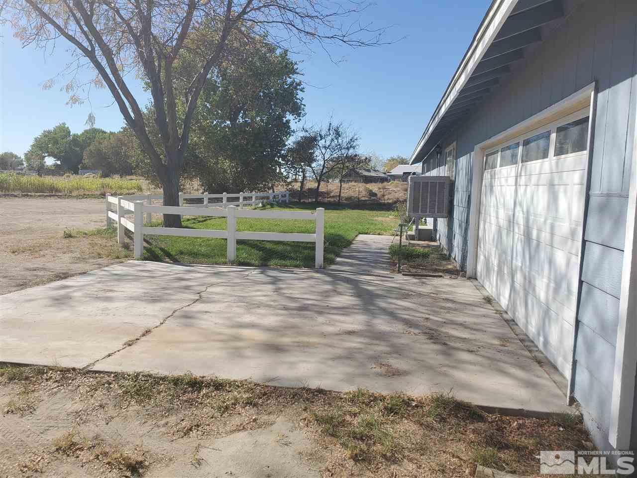 6975 Cox Road Fallon, NV 89406 - Photo 4 of 18 a view of yard with swimming pool and green space