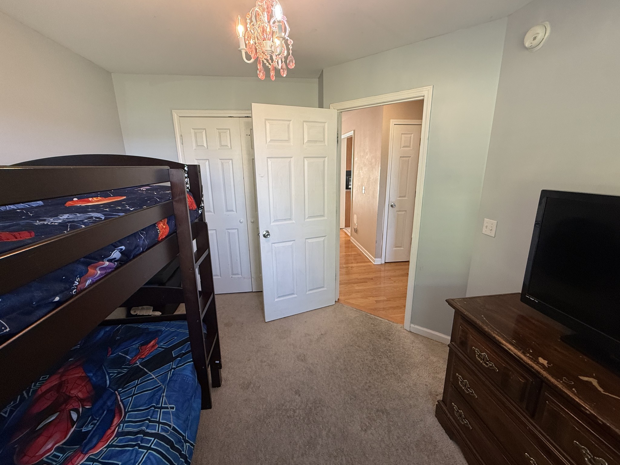 1702 Abiff Road Burns, TN 37029 - Photo 29 of 47 a bedroom with a bed and a chandelier