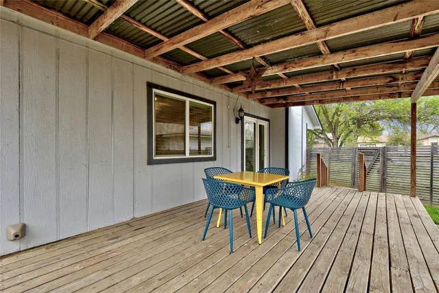 a view of a house with a table and chairs