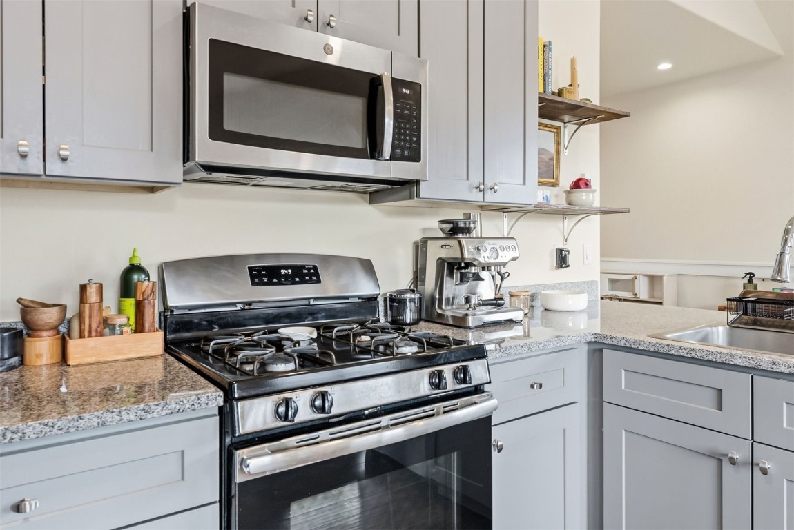 119 Wayback Drive, Unit 119 Keystone, CO 80435 - Photo 11 of 29 a kitchen with stainless steel appliances granite countertop white cabinets a stove a sink and dishwasher