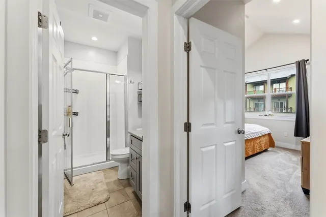 a bathroom with a shower and a sink