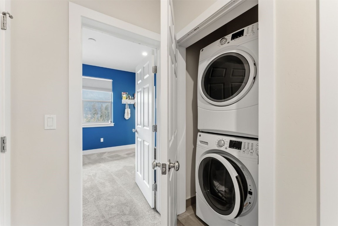 119 Wayback Drive, Unit 119 Keystone, CO 80435 - Photo 22 of 29 a view of a hallway with washer and dryer