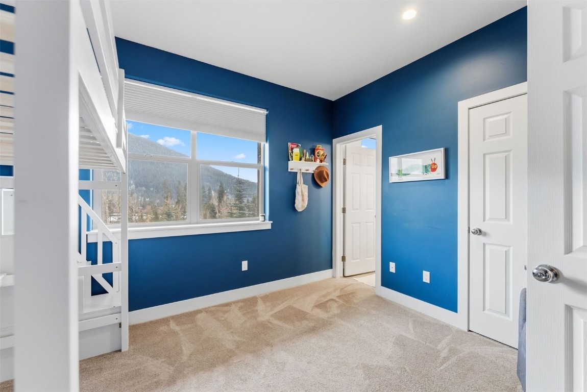 119 Wayback Drive, Unit 119 Keystone, CO 80435 - Photo 23 of 29 a view of an empty room with window and refrigerator