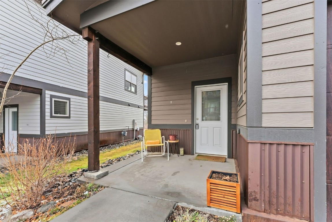 119 Wayback Drive, Unit 119 Keystone, CO 80435 - Photo 28 of 29 a view of a patio with table and chairs with wooden fence and plants