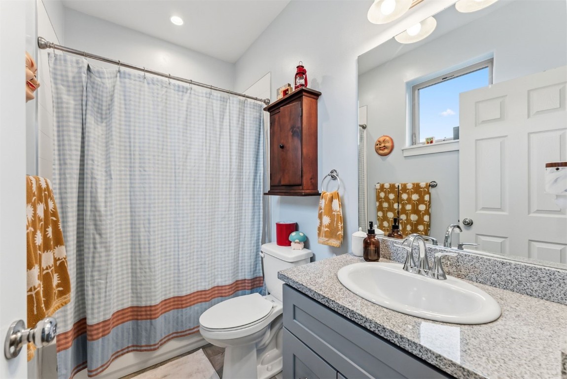 119 Wayback Drive, Unit 119 Keystone, CO 80435 - Photo 6 of 29 a bathroom with a sink a toilet and shower curtain
