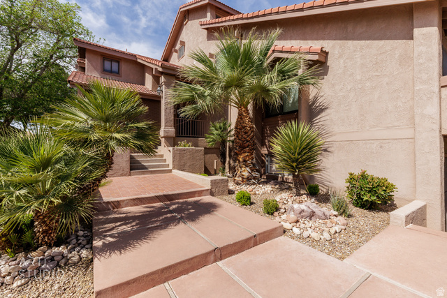 860 South Village Road, Unit A6 St. George, UT 84770 - Photo 2 of 41 View of front of house with a tiled roof and stucco siding
