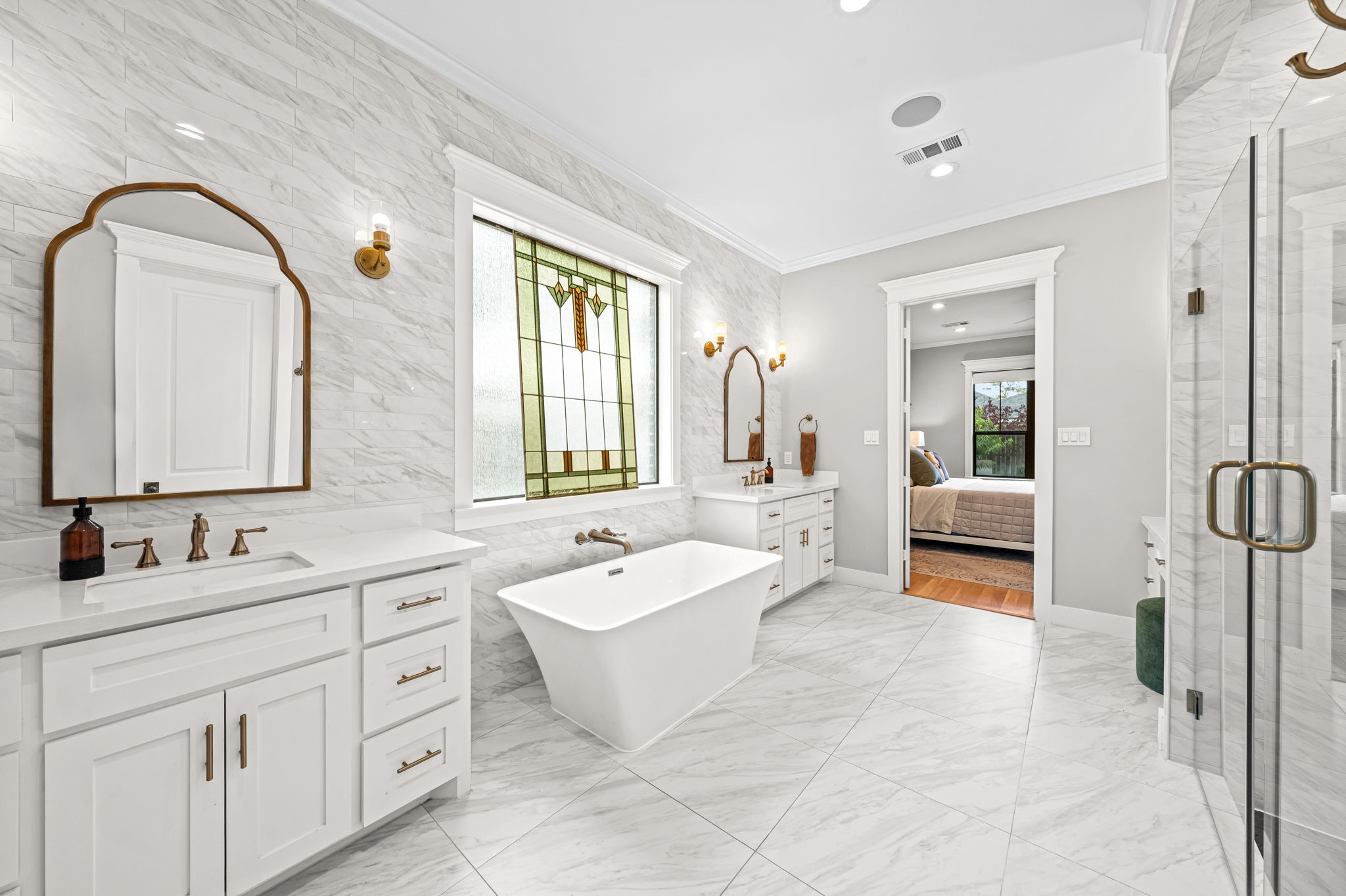 1013 Martin Street Houston, TX 77018 - Photo 23 of 46 Another view of this spa-like primary bath offering a peaceful, elevated feel. Complete w/ceiling speakers, extensive storage and private water closet.
