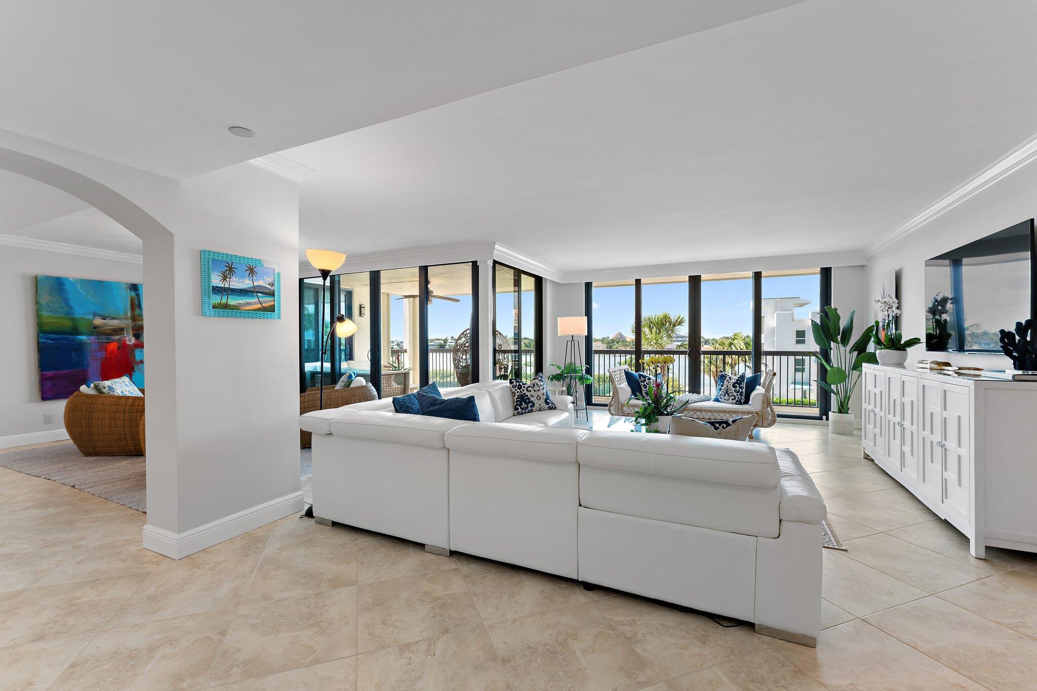 19670 South Beach Road, Unit B303 Jupiter, FL 33469 - Photo 18 of 104 a living room with furniture and a large window