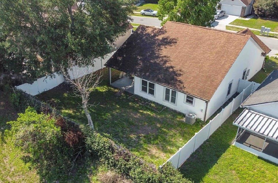 10665 Huntridge Road Orlando, FL 32825 - Photo 12 of 12 a view of a house with a yard