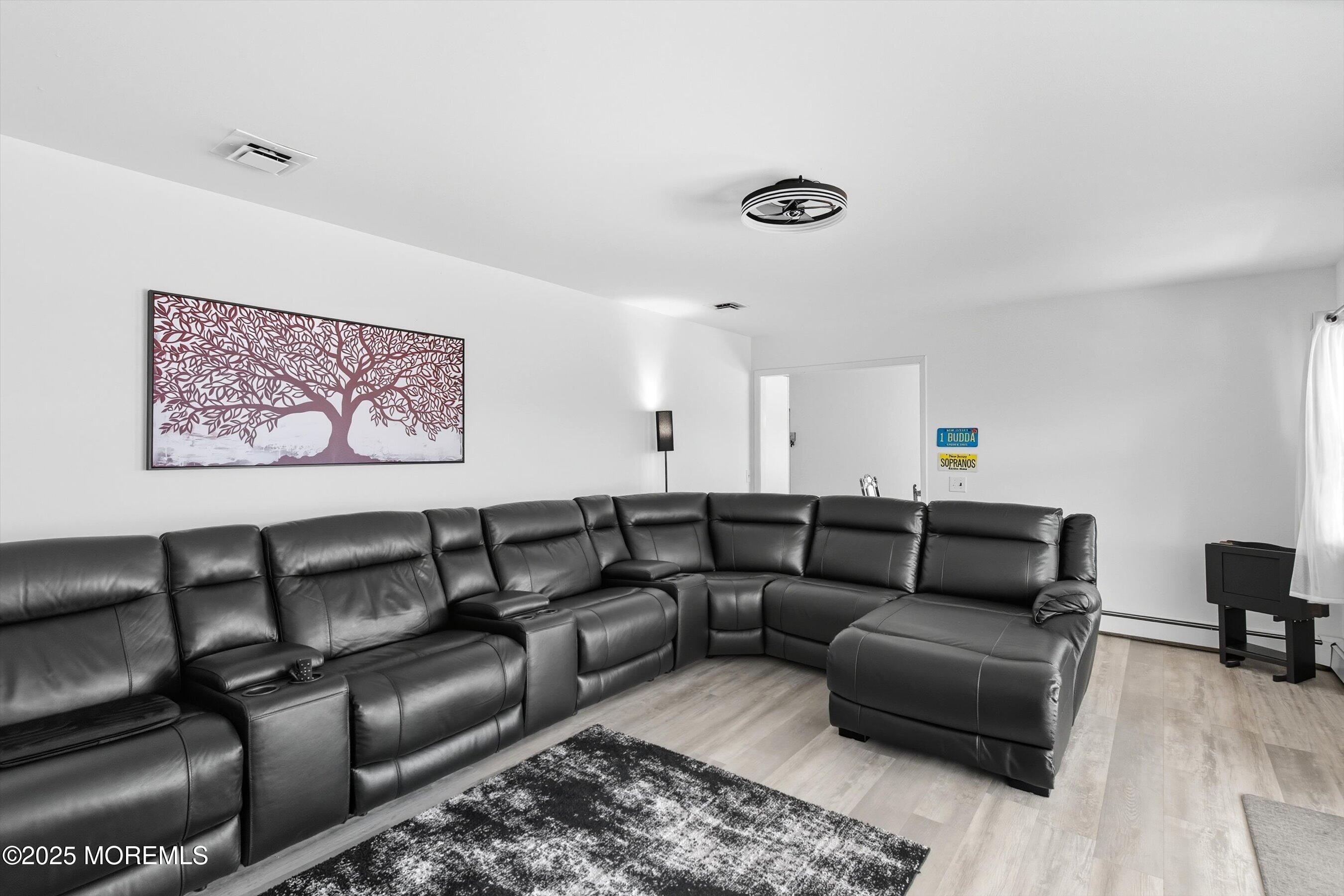 173 Cliff Road Brick, NJ 08724 - Photo 17 of 37 a living room with furniture and a couch