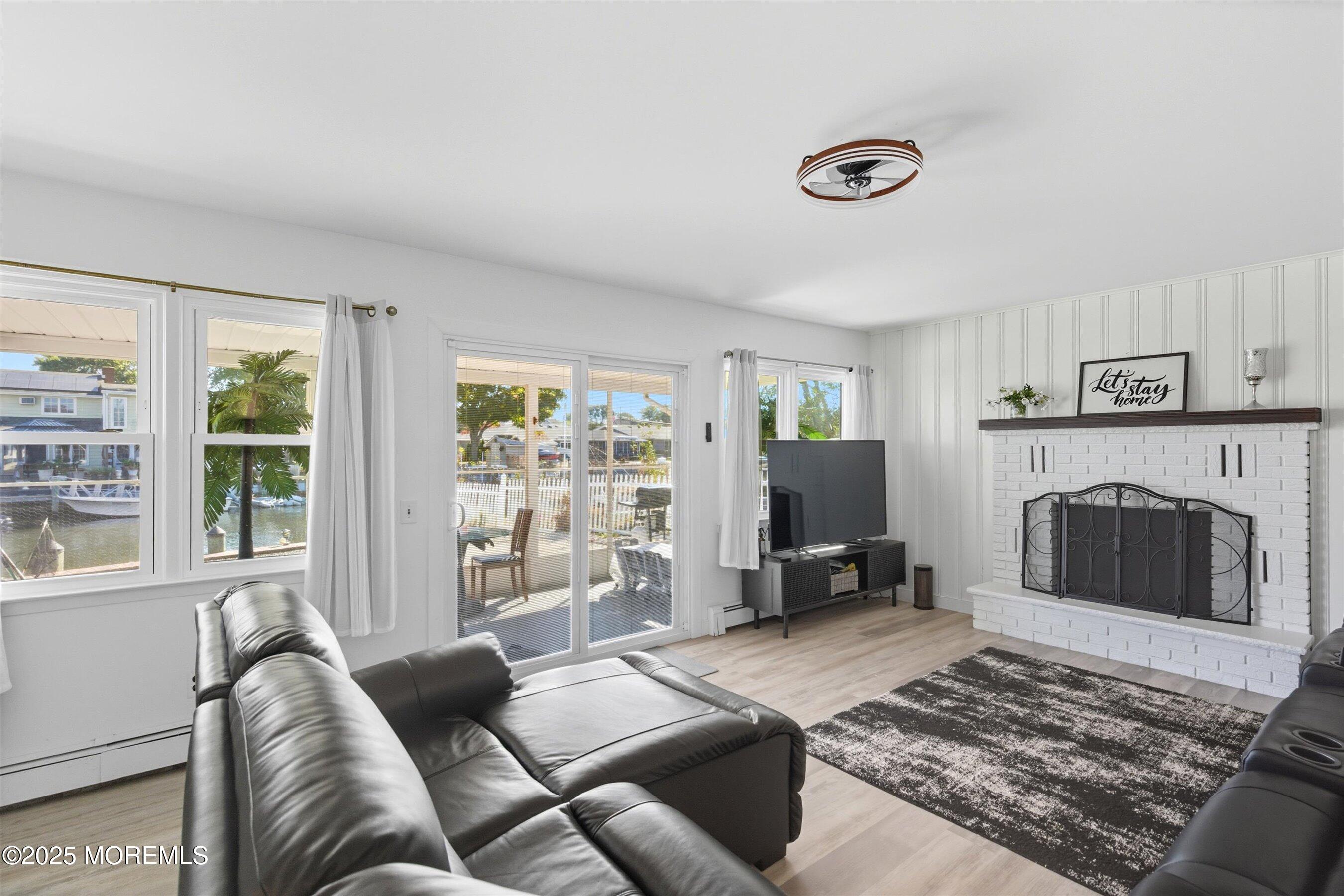 173 Cliff Road Brick, NJ 08724 - Photo 18 of 37 a living room with furniture and a fireplace
