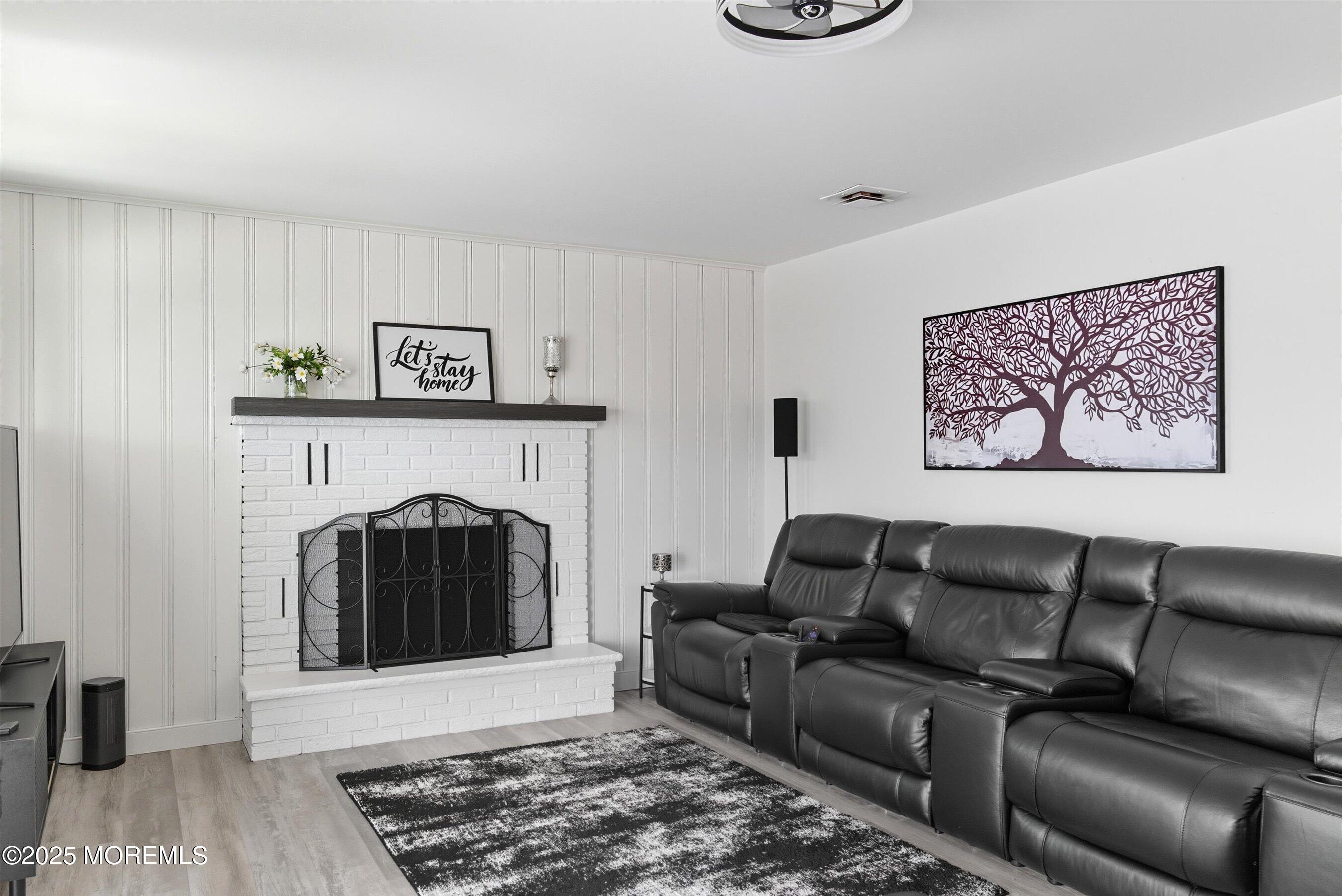 173 Cliff Road Brick, NJ 08724 - Photo 19 of 37 a living room with furniture and a fireplace
