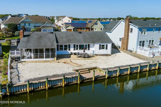 a aerial view of a house with swimming pool and porch