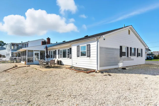 a view of a house with wooden fence
