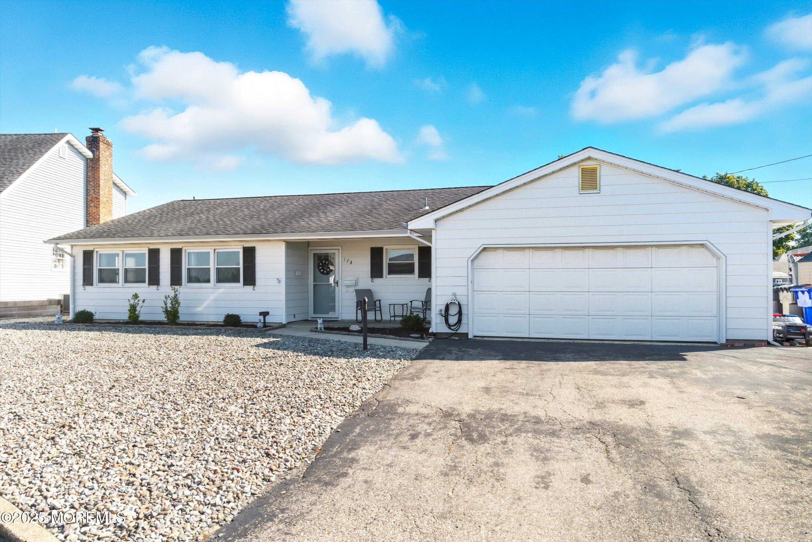 173 Cliff Road Brick, NJ 08724 - Photo 33 of 37 a front view of a house with a yard