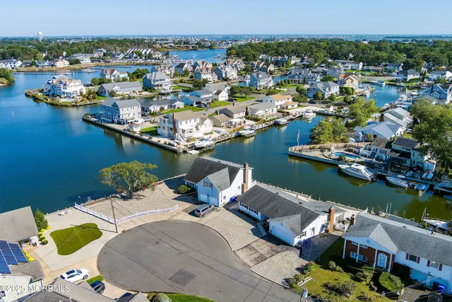 an aerial view of a house with a lake view