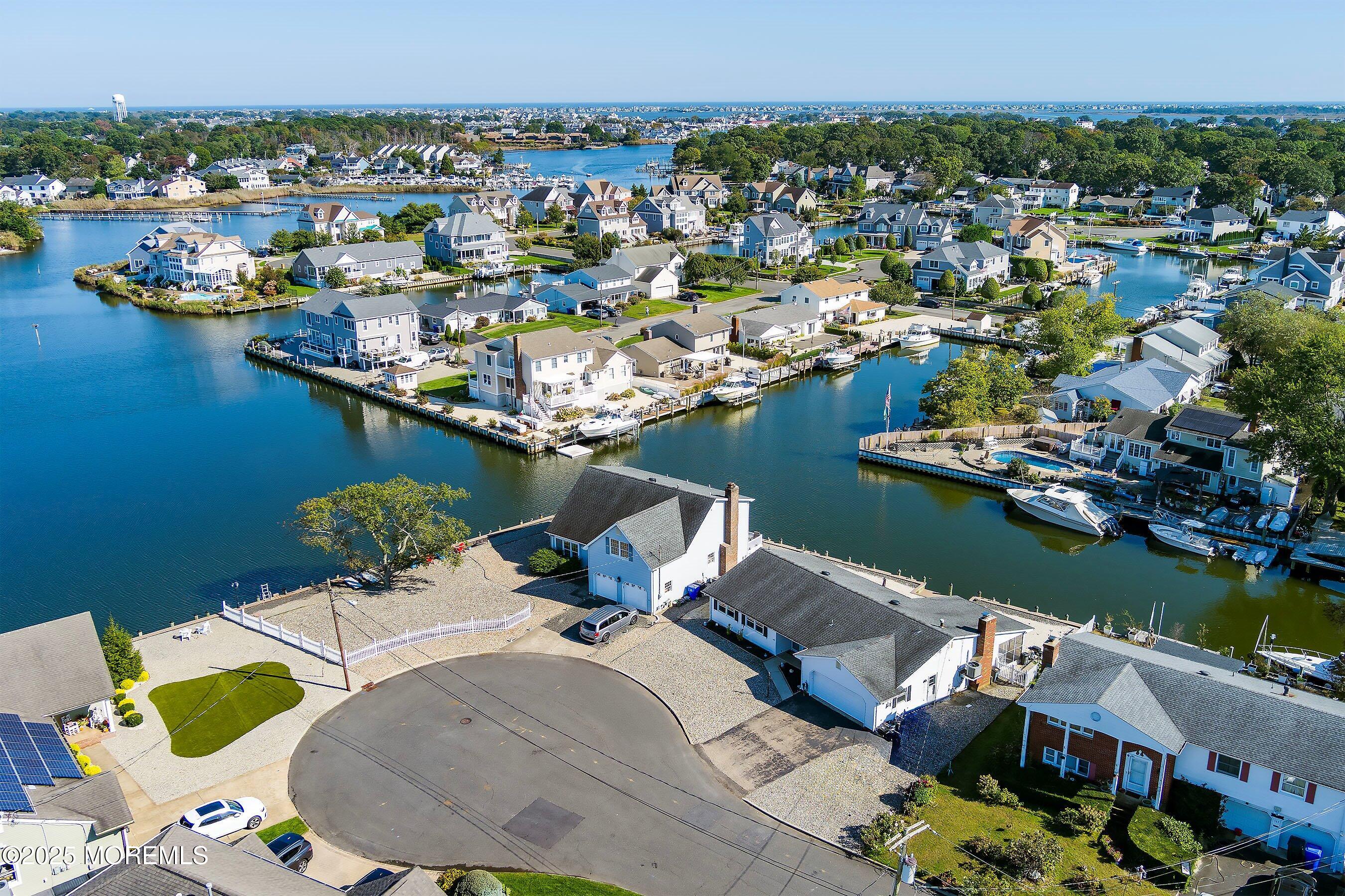 173 Cliff Road Brick, NJ 08724 - Photo 34 of 37 an aerial view of a house with a lake view