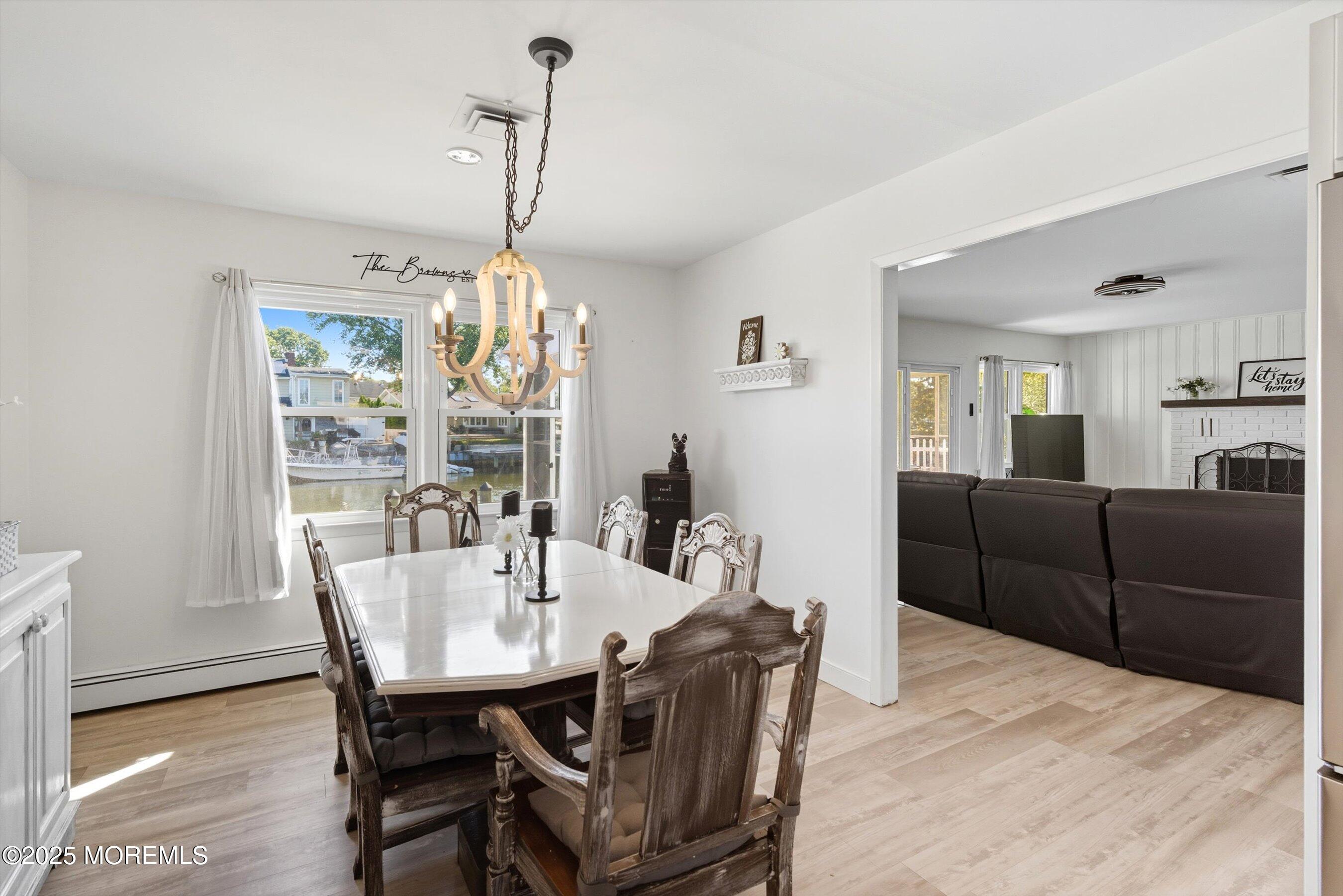 173 Cliff Road Brick, NJ 08724 - Photo 7 of 37 a view of a dining room with furniture window and wooden floor