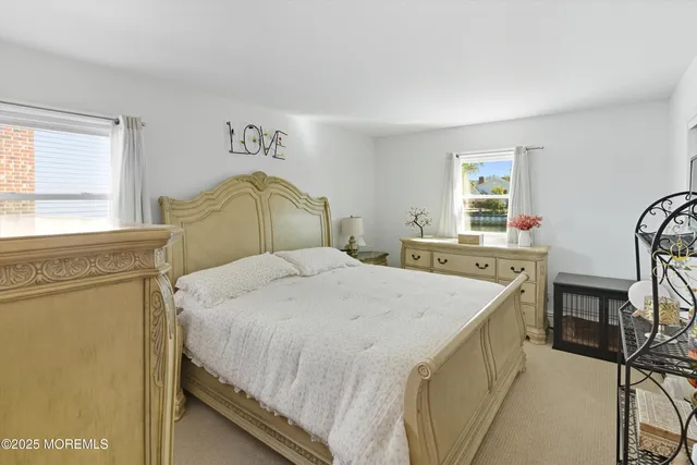 a bedroom with a bed and a cabinets