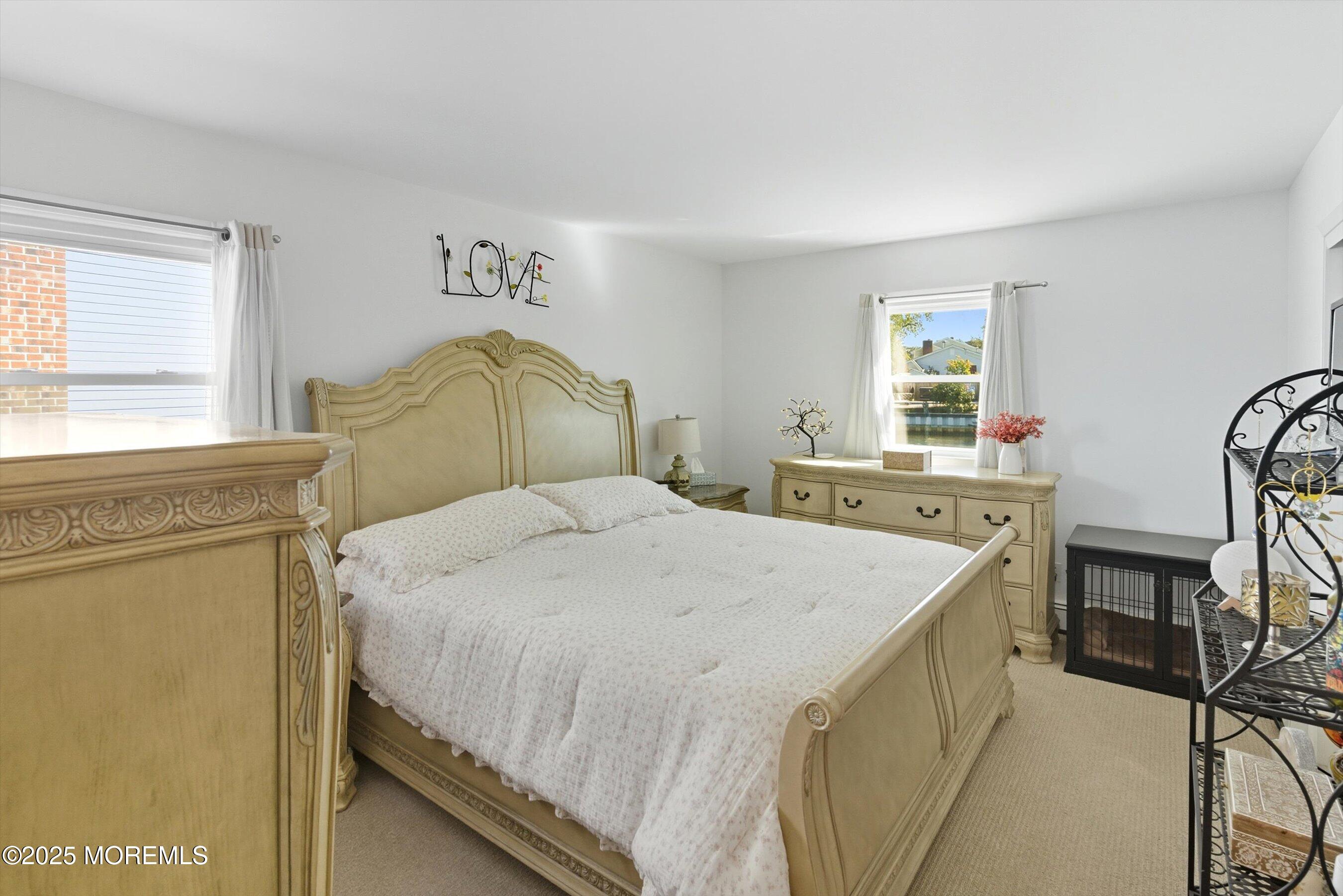 173 Cliff Road Brick, NJ 08724 - Photo 8 of 37 a bedroom with a bed and a cabinets