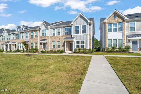 a front view of building with yard