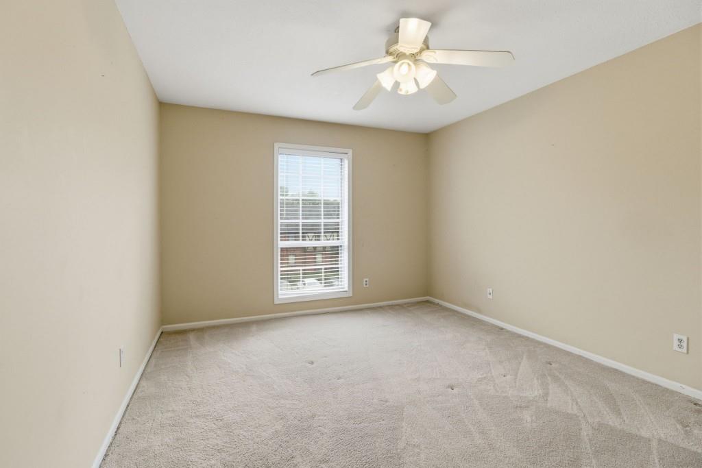 6851 Roswell Road, Unit B15 Sandy Springs, GA 30328 - Photo 20 of 30 an empty room with windows and fan