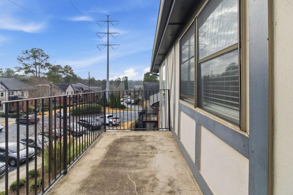 6851 Roswell Road, Unit B15 Sandy Springs, GA 30328 - Photo 26 of 30 a balcony view with a glass door
