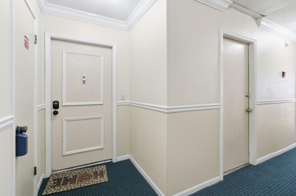 6851 Roswell Road, Unit B15 Sandy Springs, GA 30328 - Photo 3 of 30 a view of walk in closet with wooden floor