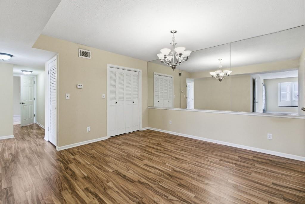 6851 Roswell Road, Unit B15 Sandy Springs, GA 30328 - Photo 7 of 30 a view of a livingroom with a chandelier